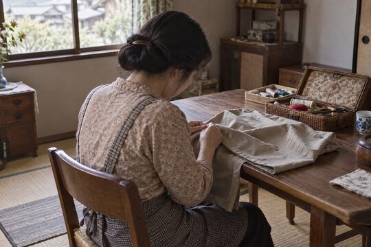 1970s Seamstress Hemming a Plain Garment at Home