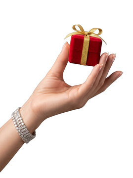 Luxury gift giving caucasian woman hand holding tiny red gift box