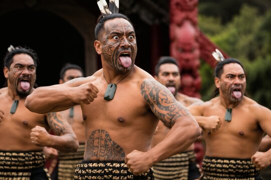 Group of Māori men performing a haka with traditional attire outdoors  