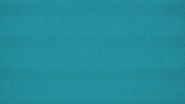 film burn transition effect, dark to teal transition, subtle texture overlay. Use this for video editing and scene changes.