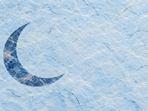 Light blue Japanese washi paper background with crescent moon motif and textured fibers