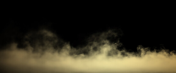 Fototapeta premium Low Lying Yellowish White Fog and Smoke Clouds Rising from Bottom Edge Against Dark Black Background with Copy Space.