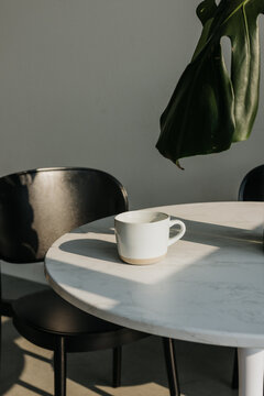 Minimalist scene with coffee mug in morning light