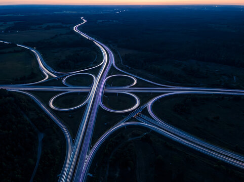 Aerial view of highway cloverleaf interchange at night