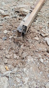Detaching Freshly Cut Rusted Iron Piece from Frame