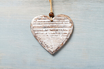 Wooden heart on light blue background, copy space. © agneskantaruk