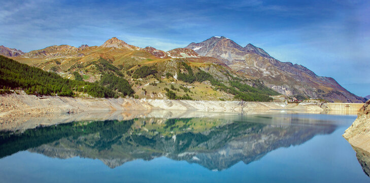 mountain reflection  on lake of a dam in the mountain landscape, lac of chevril in French Alps, Tignes, Savoie, France, Europe