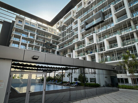 Balconies stacked around a residential courtyard in Masdar City, low carbon district near Abu Dhabi, United Arab Emirates