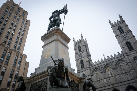 Monument in front of the old basilica in the snow in Montreal, Quebec, Canada