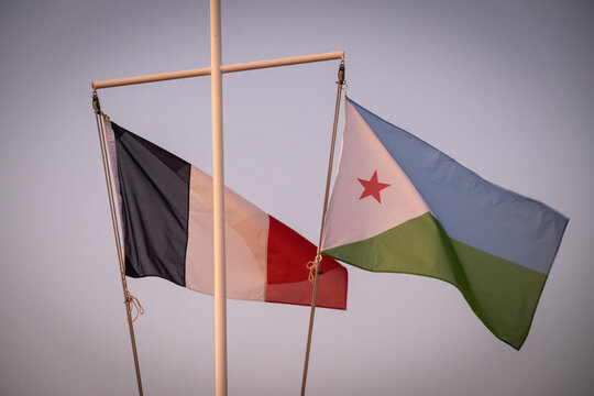 French and Djiboutian flags flying side by side at a French Army desert combat and hardening centre in Djibouti