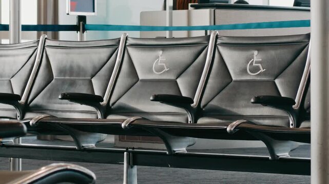 Detroit, Michigan - October 3, 2026: Accessible seating rows inside the Delta Air Lines boarding gate area at Detroit Metro Airport DTW