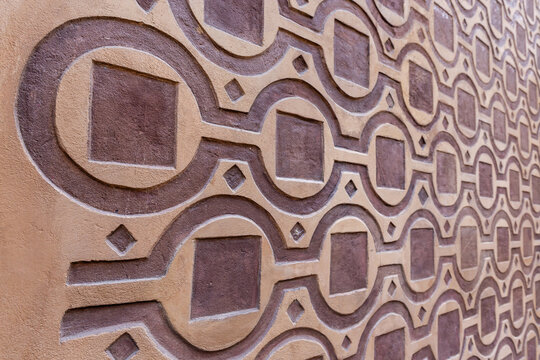 Fragment of wall with geometric pattern made with sgraffito technique