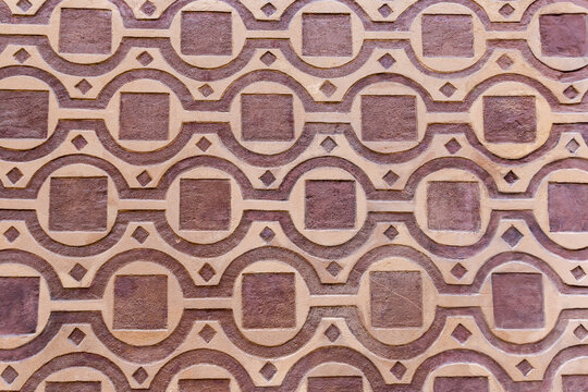 Fragment of wall with geometric pattern made with sgraffito technique
