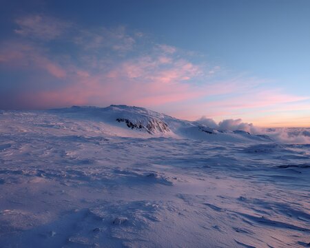 Snow-covered mountain ridge under pastel sky with soft clouds