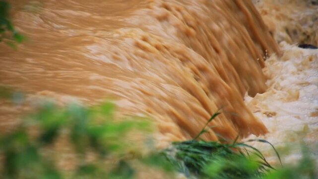 The river water flows murky due to the strong current