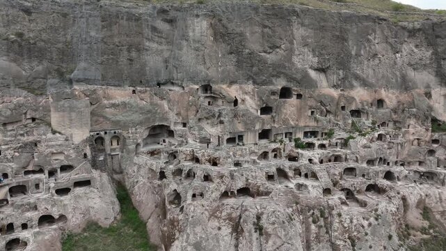 Aerial view of the ancient Vardzia cave monastery, a remarkable medieval rock hewn city and historical landmark showcasing incredible troglodyte architecture in Georgia