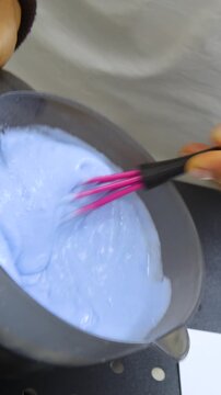 Women's Hair Salon. The stylists at the women's salon are working with a young woman. Beauty salon and makeup - vertical video.