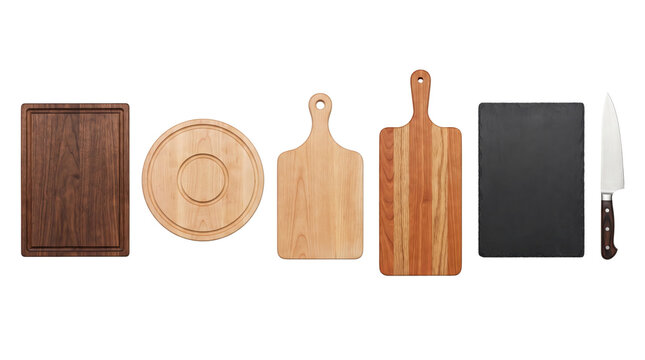 Variety of wooden and slate cutting boards with a kitchen knife
