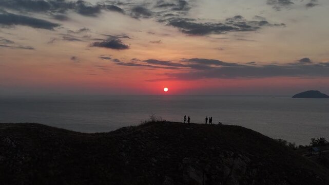 Panoramic sunset landscape from Sylvia Hill (Bukit Silvia) in Labuan Bajo during the warm golden hour.