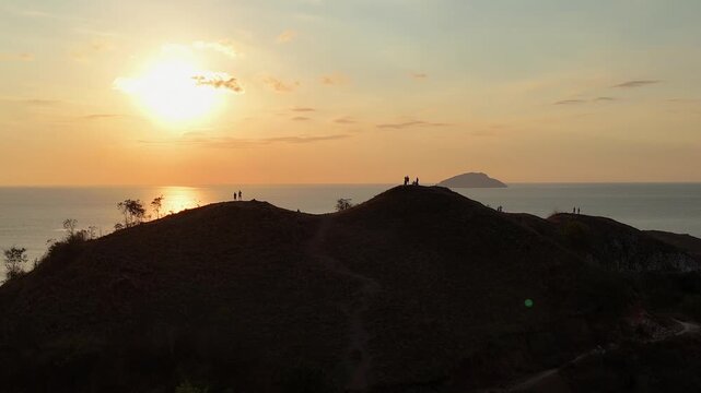 Panoramic sunset landscape from Sylvia Hill (Bukit Silvia) in Labuan Bajo during the warm golden hour.