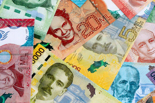 Costa Rican colon money banknotes pile on table. Costa Rica bills of CRC currency close up