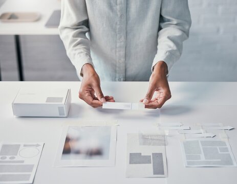 Visual communication designer reviewing packaging layouts