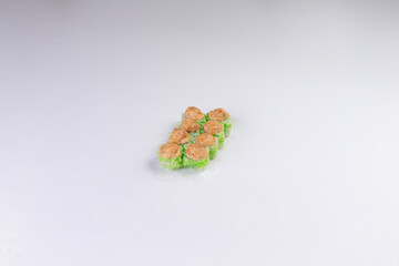 Green tobiko sushi rolls with spicy salmon topping culinary arts food © Игорь Соколов