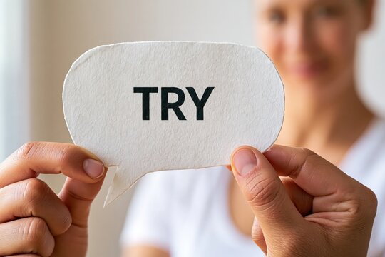 Person holding try sign motivation message concept business inspiration