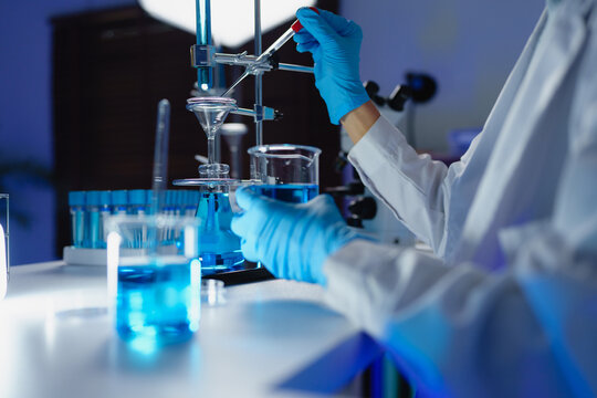 Scientist conducting scientific research and analysis in laboratory