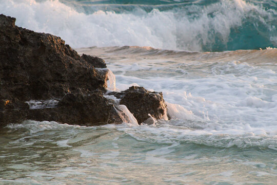 waves crashing on rocks