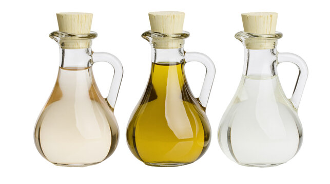 Isolated glass cruets filled with various oils and vinegars for cooking ingredients