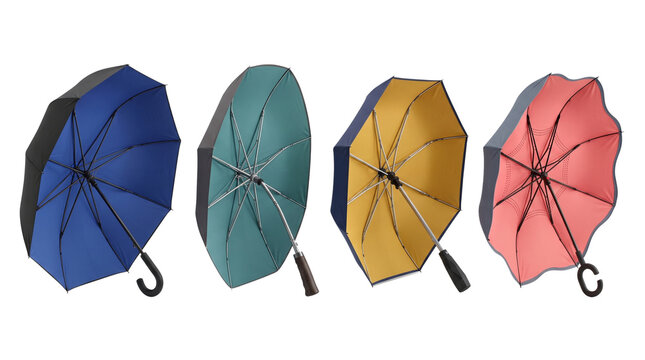 Colorful open umbrellas collection isolated on white background, set of four rainy weather protection parasols, multi colored rain accessories studio shot