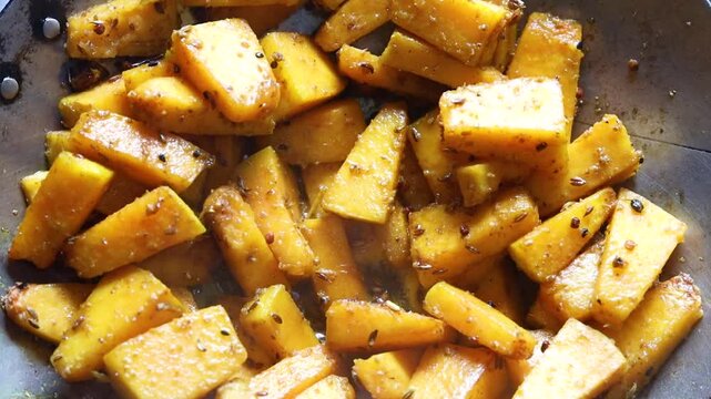 pumpkin saute on a pan with Indian spices