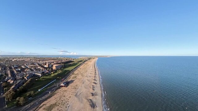 Travel and History: Aerial Drone Shot of Sunny Southsea Seafront and Promenade Overlooking the Solent in Portsmouth, Hampshire