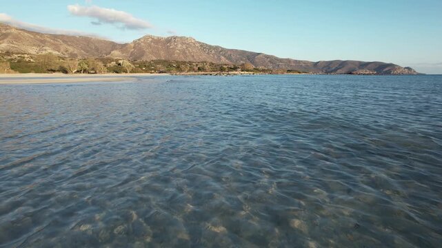 Low flight over crystal clear shallow water at Elafonisi - Crete