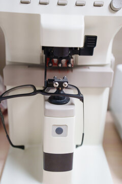 Optical frame tracing tool in optician workshop