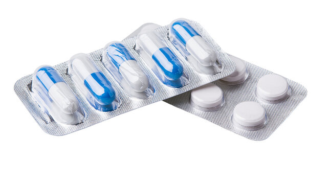 Isolated medication blister packs with blue white capsules and round white tablets
