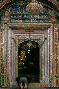 Man Praying at Khanqah e Moula Shrine Door in Srinagar Kashmir