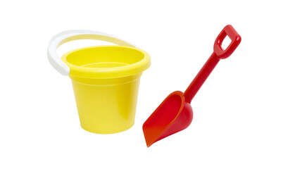 Isolated yellow plastic beach toy bucket and red shovel for children's outdoor play © Saoirse
