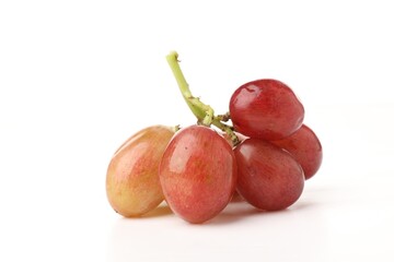 Fototapeta premium Bunch of fresh ripe grapes on white background