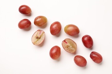 Fototapeta premium Fresh ripe grapes on white background, flat lay
