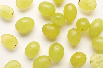 Fototapeta premium Fresh ripe grapes on white background, flat lay