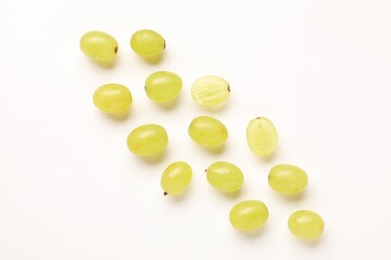 Fototapeta premium Fresh ripe grapes on white background, flat lay