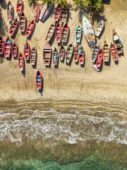 Fototapeta premium Aerial top down view of wooden fishing boats lined up, Tarrafal beach Cape Verde
