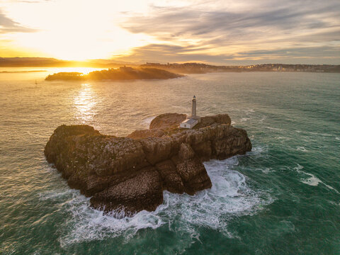 Aerial view of the Mouro Island Lighthouse at sunset, Santander, Spain