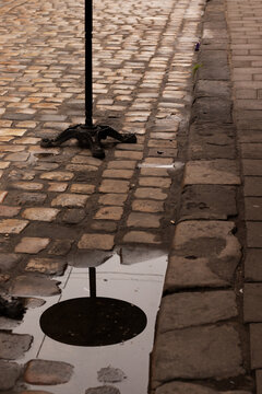 Outdoor Cafe Table Reflected in a Rain Puddle. Close-up.