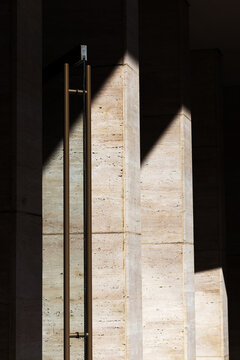Minimalist Architectural Details of Rough Stone Walls. Texture with Deep Shadows. Close-up.