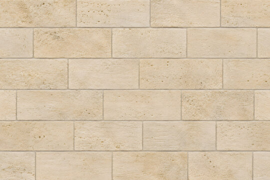 Warm cream limestone block wall with subtle pores, natural tonal variation and clean mortar joints, ideal for architecture, luxury interiors and neutral backgrounds.