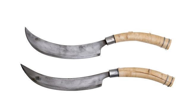 Isolated pair of traditional curved blades with natural wood handles, ethnic outdoor tools
