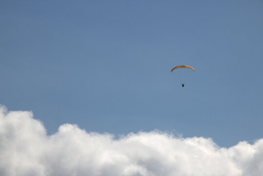 Paraglider above the clouds